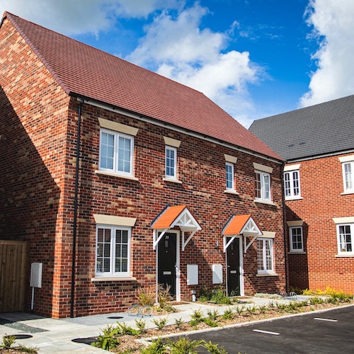 Red brick houses with blue sky-min